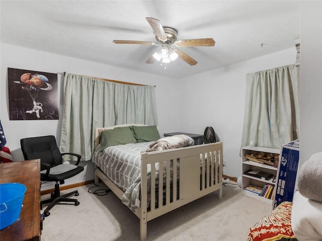 bedroom featuring ceiling fan and light carpet