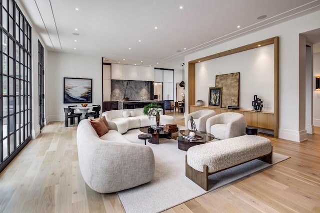 living room with light hardwood / wood-style flooring