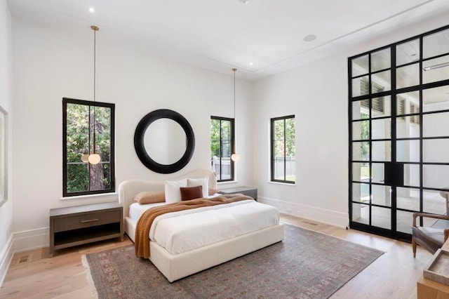 bedroom with light hardwood / wood-style floors