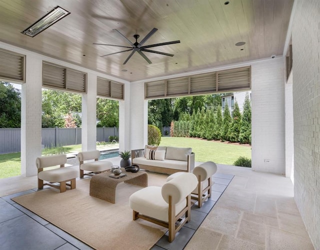 sunroom / solarium with ceiling fan and wooden ceiling