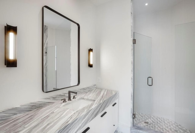 bathroom with vanity and walk in shower