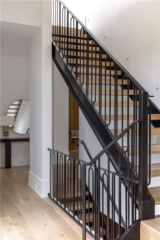 stairs with wood-type flooring