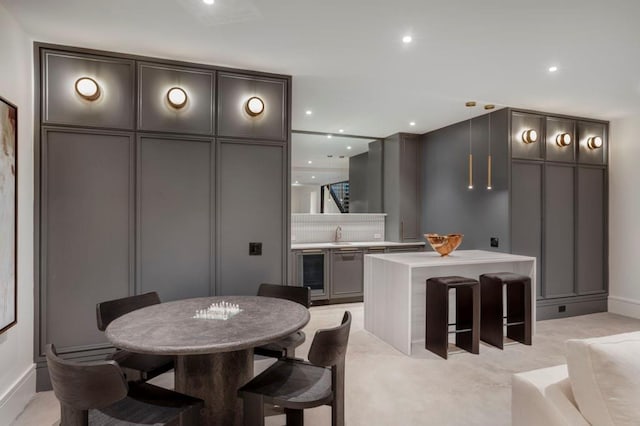 dining space with sink and wine cooler