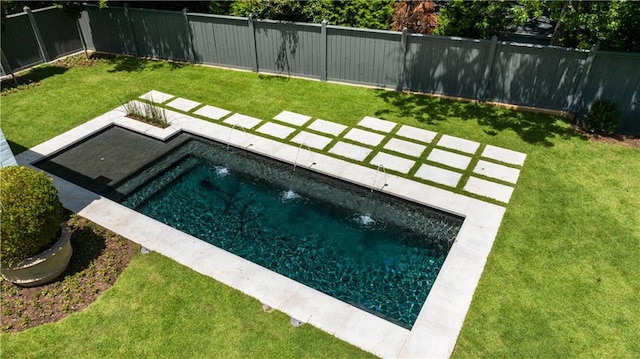 view of swimming pool featuring a lawn and pool water feature