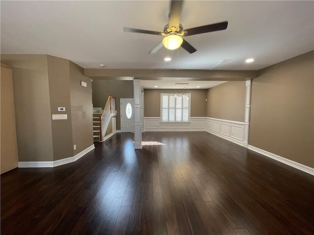 unfurnished living room featuring recessed lighting, a decorative wall, stairway, dark wood-type flooring, and ceiling fan