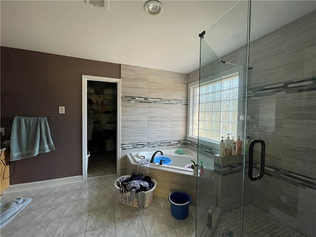 bathroom with shower with separate bathtub