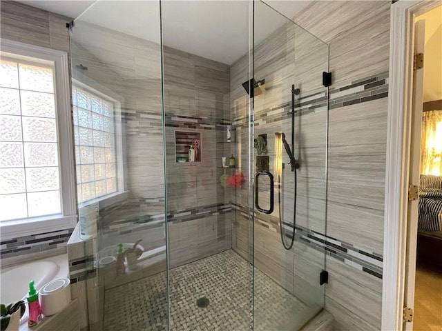 bathroom with tile walls and independent shower and bath