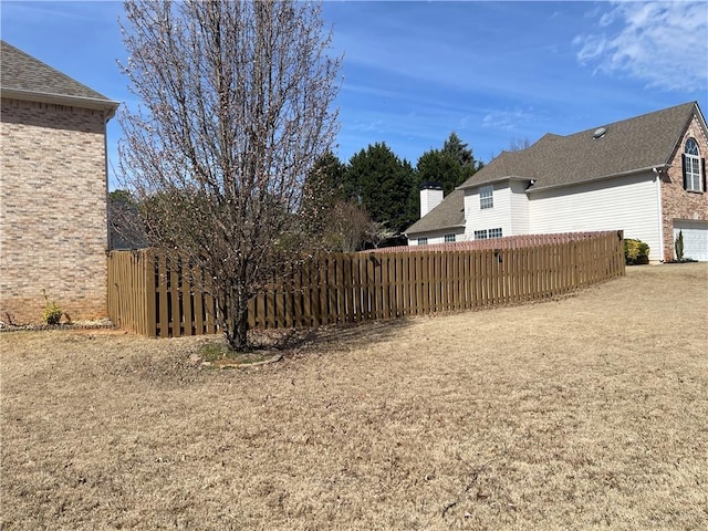 view of yard with fence