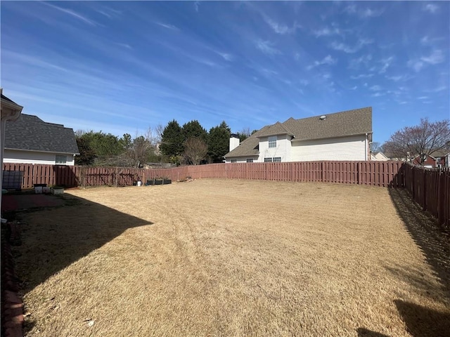 view of yard featuring a fenced backyard