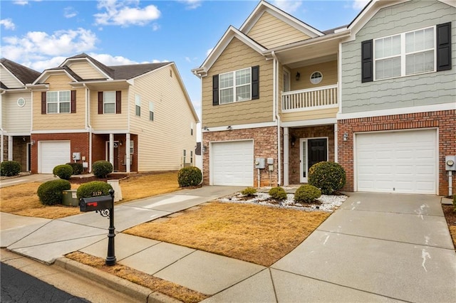 townhome / multi-family property featuring a garage