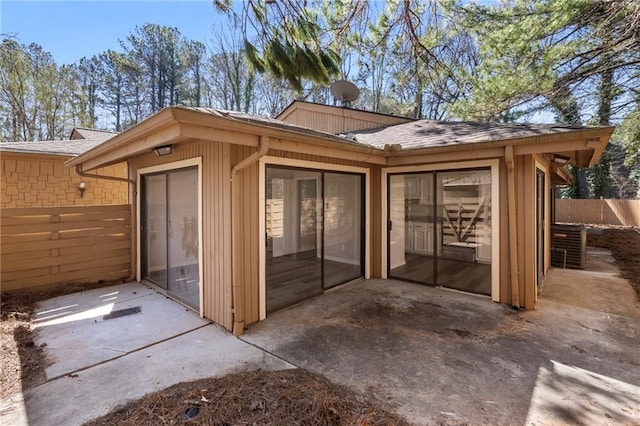 view of outbuilding with fence