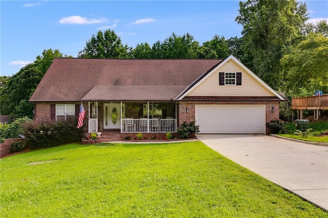 144 Bobs Dr SW, Mableton, GA 30126 - view of front of house featuring a front lawn, a porch, concrete driveway, an attached garage, and brick siding