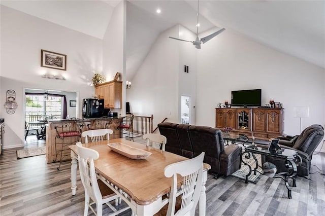 144 Bobs Dr SW, Mableton, GA 30126 - dining room with baseboards, light wood-style flooring, high vaulted ceiling, and ceiling fan