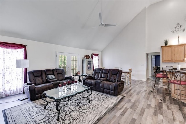 144 Bobs Dr SW, Mableton, GA 30126 - living area featuring light wood-style flooring, high vaulted ceiling, and a ceiling fan