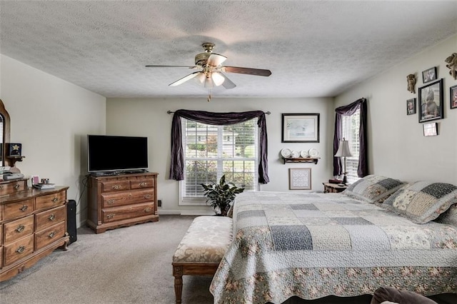 144 Bobs Dr SW, Mableton, GA 30126 - bedroom featuring a ceiling fan, carpet, baseboards, and a textured ceiling