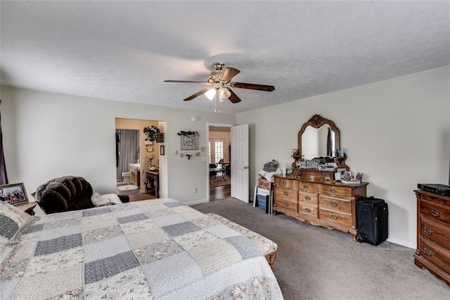 144 Bobs Dr SW, Mableton, GA 30126 - bedroom with a ceiling fan, a textured ceiling, and carpet flooring