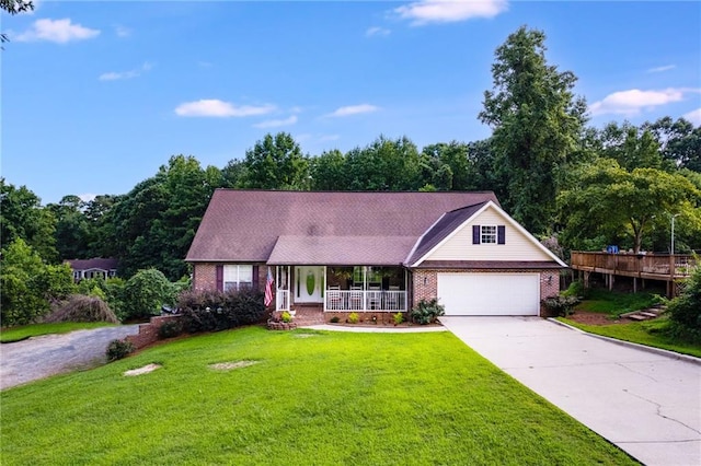 144 Bobs Dr SW, Mableton, GA 30126 - view of front facade with brick siding, an attached garage, a front yard, covered porch, and driveway