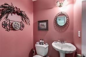 144 Bobs Dr SW, Mableton, GA 30126 - half bathroom with toilet and a sink