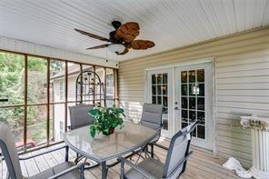144 Bobs Dr SW, Mableton, GA 30126 - sunroom / solarium featuring french doors, plenty of natural light, and a ceiling fan