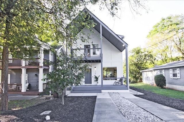 view of front of home with a balcony and covered porch