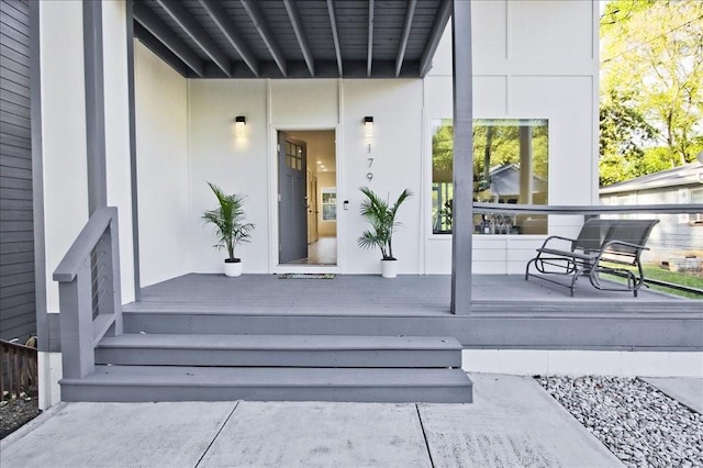 property entrance featuring covered porch