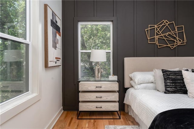 156 Martha Ave NE, Atlanta, GA 30317 - bedroom featuring a chandelier and wood finished floors