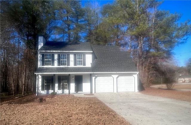 view of front of property with covered porch and a garage