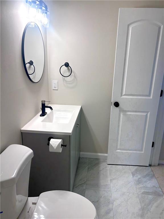 bathroom with vanity and toilet