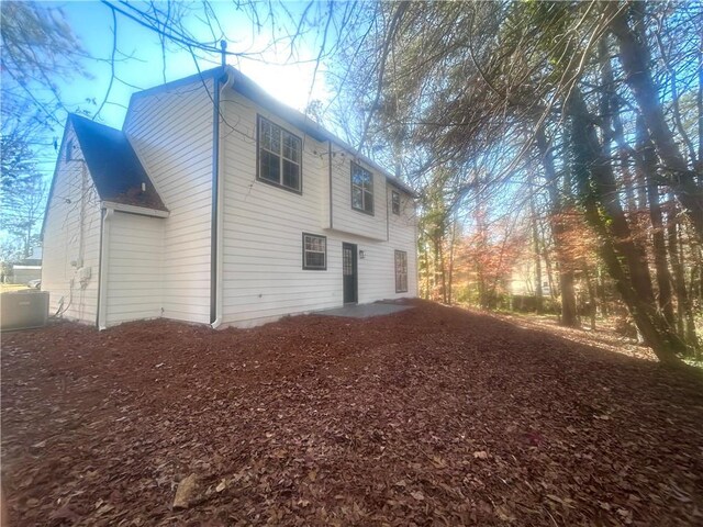 view of side of property with cooling unit