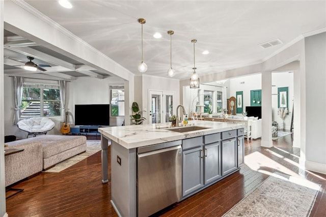 kitchen featuring gray cabinetry, a center island with sink, sink, pendant lighting, and stainless steel dishwasher