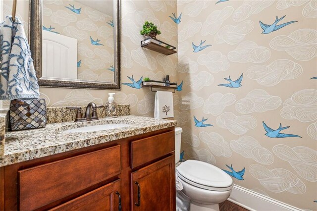 bathroom with vanity and toilet