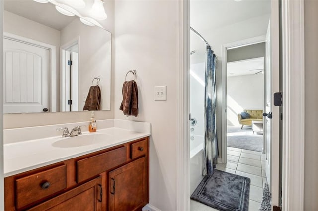 bathroom featuring vanity, shower / tub combo with curtain, and tile patterned floors