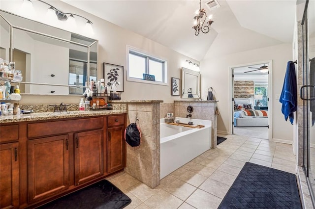 bathroom with lofted ceiling, shower with separate bathtub, ceiling fan, vanity, and tile patterned floors