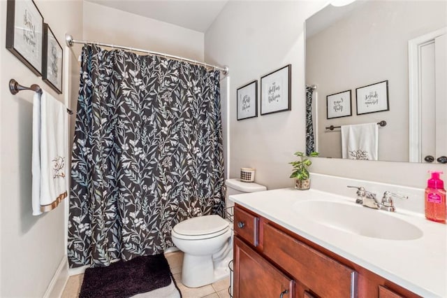 bathroom with vanity, curtained shower, toilet, and tile patterned flooring