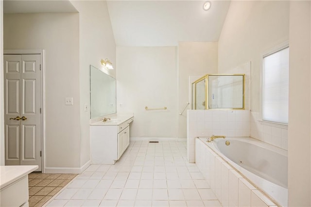 205 Finsbury Park Ct, Suwanee, GA 30024 - bathroom featuring lofted ceiling, vanity, a jetted tub, a shower stall, and tile patterned flooring