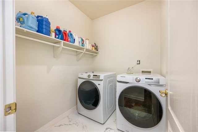 205 Finsbury Park Ct, Suwanee, GA 30024 - laundry area featuring washing machine and clothes dryer and light marble finish floors