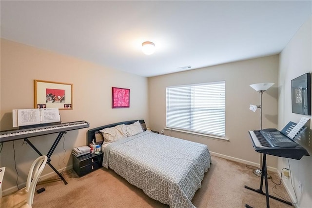 carpeted bedroom featuring visible vents and baseboards