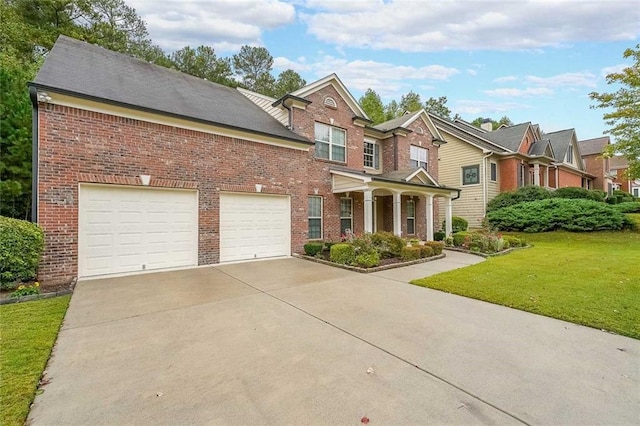 view of front of house featuring a garage, concrete driveway, brick siding, and a front lawn