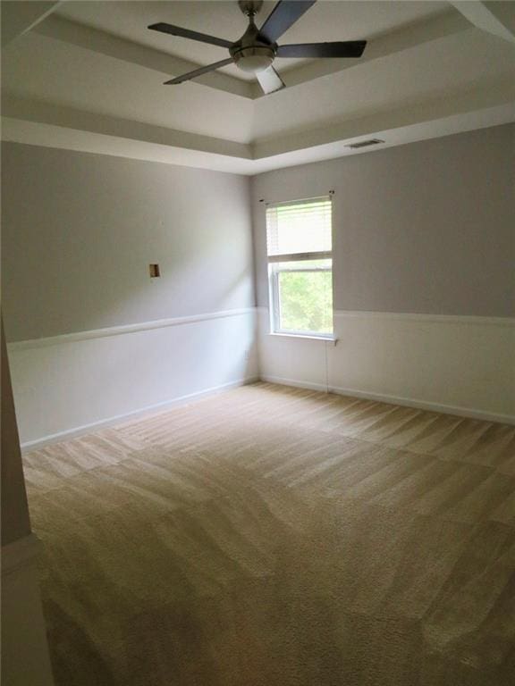 58 Torero Trl, Newnan, GA 30263 - carpeted spare room with a ceiling fan and a tray ceiling