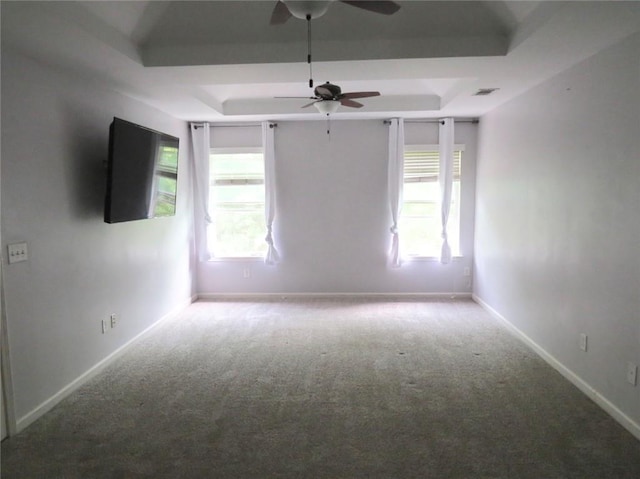 58 Torero Trl, Newnan, GA 30263 - empty room with a raised ceiling, a ceiling fan, carpet floors, and baseboards