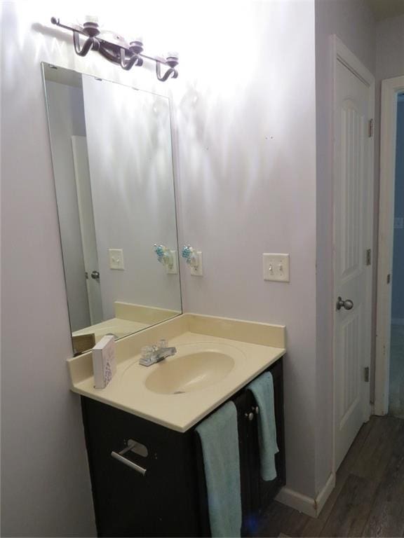 58 Torero Trl, Newnan, GA 30263 - bathroom featuring vanity, wood finished floors, and baseboards