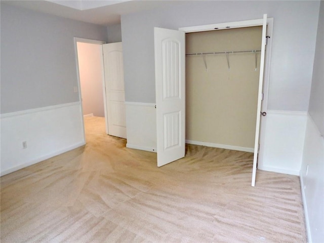 58 Torero Trl, Newnan, GA 30263 - unfurnished bedroom with carpet, a closet, and baseboards