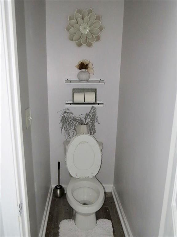 58 Torero Trl, Newnan, GA 30263 - bathroom featuring baseboards, toilet, and wood finished floors