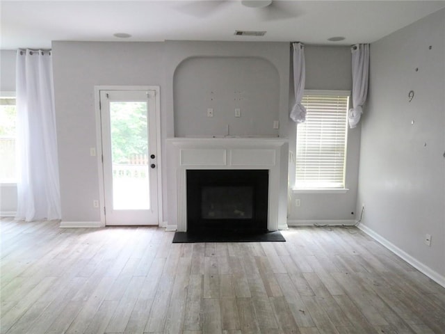 58 Torero Trl, Newnan, GA 30263 - unfurnished living room with a fireplace, wood finished floors, and baseboards
