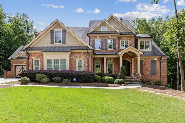 craftsman inspired home featuring a garage and a front yard