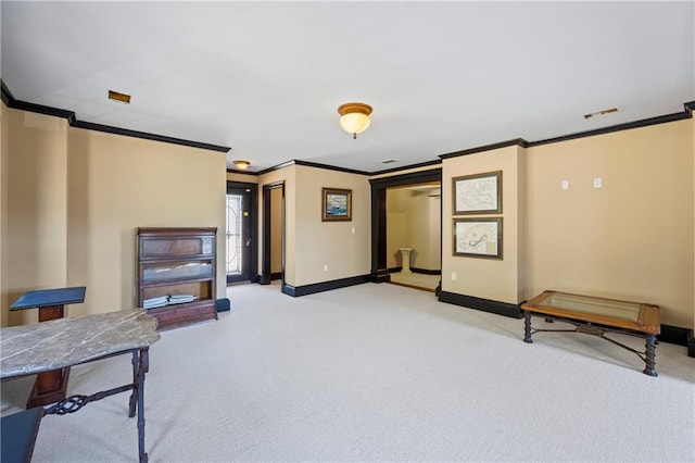 interior space with ornamental molding, light carpet, and baseboards