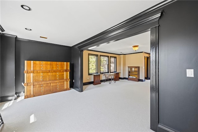 interior space with crown molding and baseboards