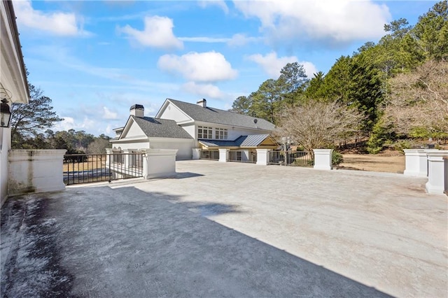 view of front facade featuring a gate and fence