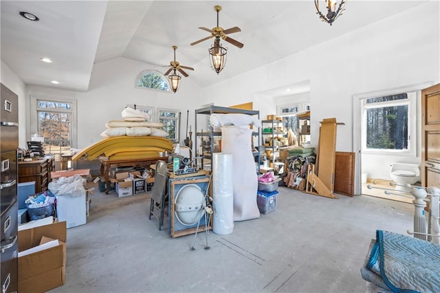 interior space with concrete flooring, lofted ceiling, and ceiling fan