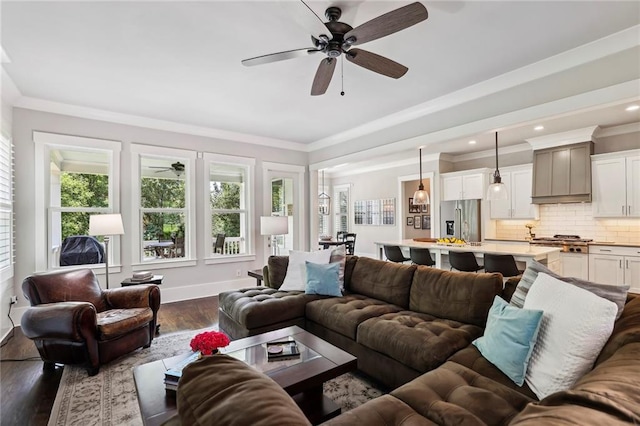 living room featuring baseboards, a ceiling fan, dark wood-style flooring, crown molding, and recessed lighting